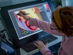 Header image of student working on a digital painting