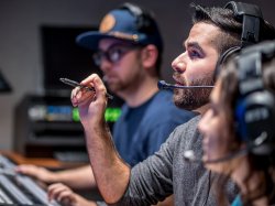 people with headsets in studio
