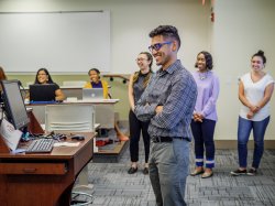 student presenting to classmates