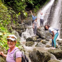 Students at waterfall in jungle