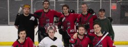 Montclair State University's club roller hockey team taking a team photo in the rink