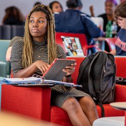 Student in lounge using tablet