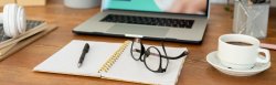 open-notebook-with-pen-and-eyeglasses