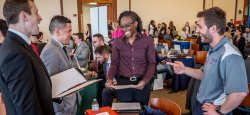 Picture of a student speaking with a prospective employer at a career fair.