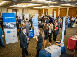 Students and employers talking to one another at a Career Fair in the Conference Center.
