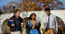 Students walking on campus in the fall.