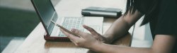 PIcture of a student working on her laptop