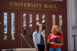 Two students outside University Hall entrance