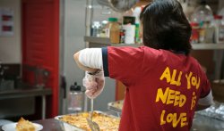 Woman volunteering serving food