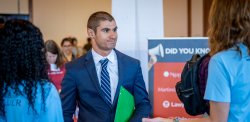 Man in suit at a career fair
