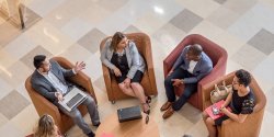 Professionals talking in a lounge area