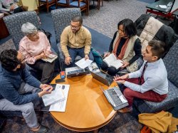 Photo of Higher Education students working together