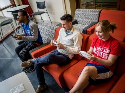 Students playing video games together