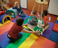 Teacher playing with children