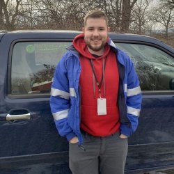 Man leaning up against a pickup truck