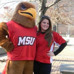 Student posing with rocky