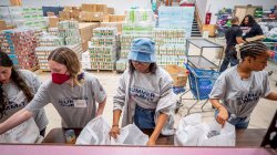 NextGen students help pack grocery bags at local food pantry.