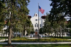 College hall with flag.