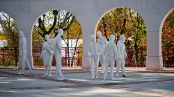 Statuses in front of college hall.