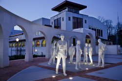 Statues outside college hall and kasser theater at night