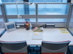 Two chairs next to each other at desk in Center for Writing Excellence.