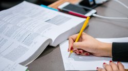 chemistry class, student taking notes