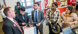 Students speaking with employer