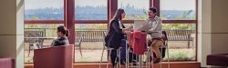 student studying with NYC skyline in background