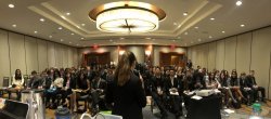 photo from behind a podium looking out at crowd