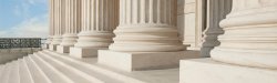 photo of white legal building steps with large stone columns