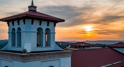 aerial view of the University Hall Bell Tower at sunrise