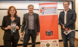 photo of Marcia Marley, David Galef and Mark Rotella pictured standing together next to a vertical banner for the Montclair Film Festival