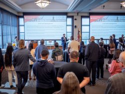 President Jonathan Koppell (in photos above and below) delivers a welcoming address, touting the exceptional student research at the symposium.