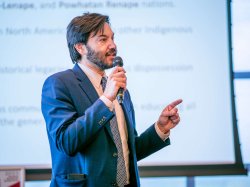 President Jonathan Koppell (in photos above and below) delivers a welcoming address, touting the exceptional student research at the symposium.