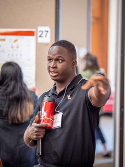Graduate student presenting his research
