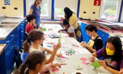 students making Chinese crafts with MSU volunteers