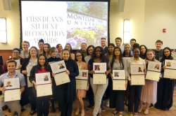 a large group of students stand together at CHSS Dean's Student Recognition Awards ceremony