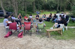 students sitting in circle outdoors