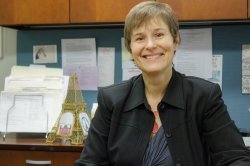photo of professor Elizabeth Emery smiling in her office