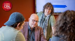 Photo of Professors Koen DePryk and Ilse Wambacq teaching a CBiL course