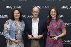 three CHSS faculty and staff standing together for photo and holding excellence awards
