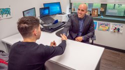 Advisor Shaking hands with a student