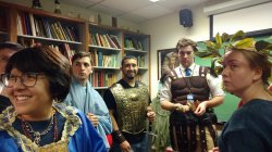 students in classical garb in professor's office