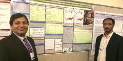 mentor and student with research poster