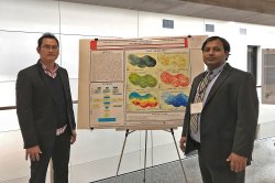 Pankaj Lal and student with poster