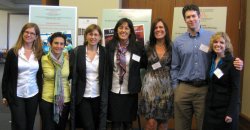 Italian faculty in front of posters
