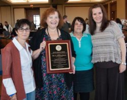 Teaching Italian Symposium attendees with plaque