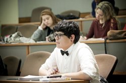 male student in lecture hall