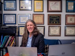 Montclair Adjunct Professor Joseph Segriff sits in front of only some of the 24 college and university diplomas he’s earned as a lifelong learner.