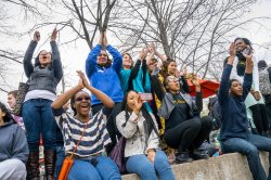 Group of students looking excited and clapping